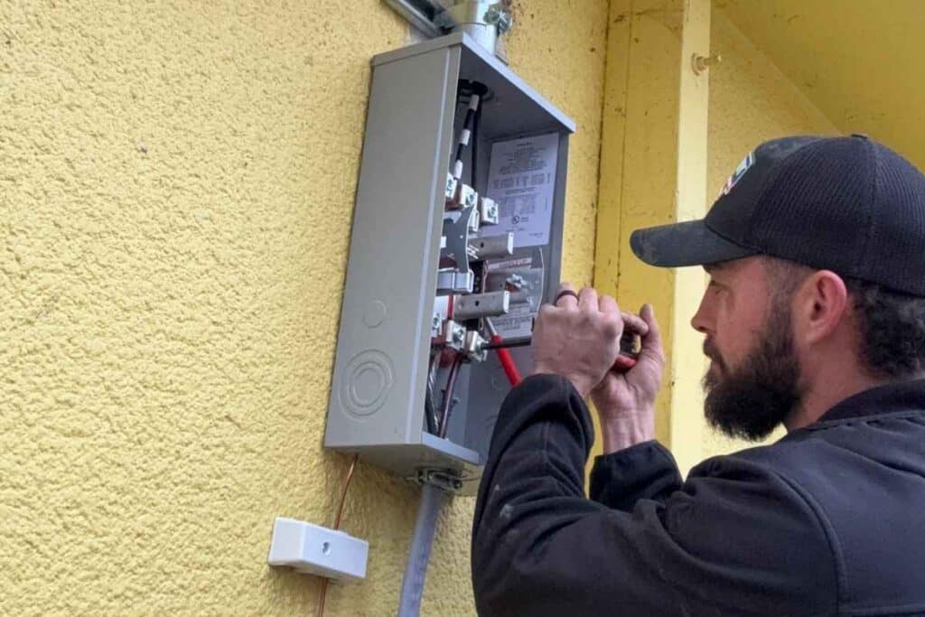 Exterior electrical meter and service entrance on an older home, where an emergency disconnect is now required on replacement.